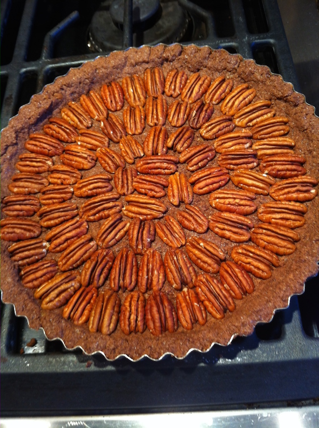 Make a design with the pecans for the Chocolate Pecan Tart