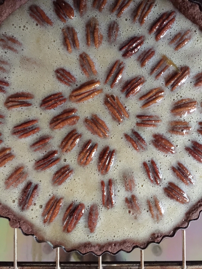 Uncooked Chocolate Pecan Tart Filling Ready for the oven