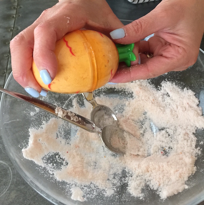 Filling Easter egg mold for Easter Egg Bath Bombs