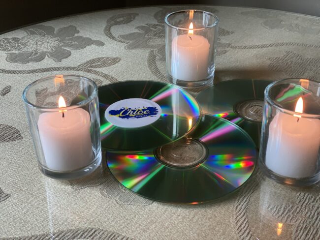 Logo'd CDs for cocktail table votives.