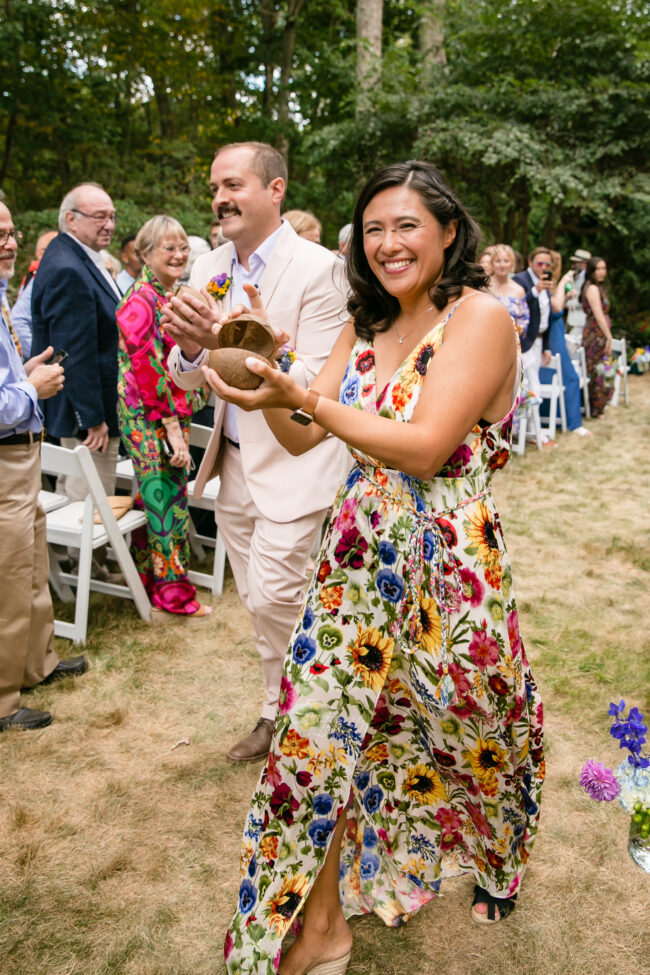 Officiants walk in coconuts a la Monty Python