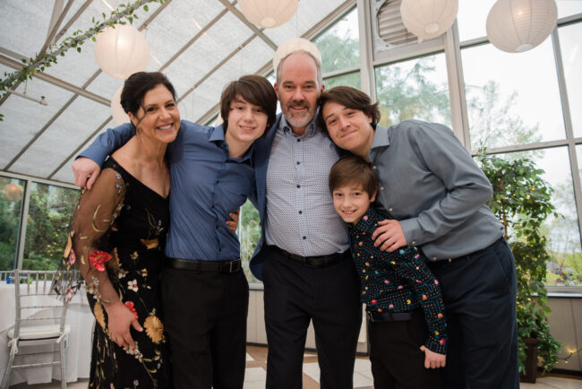 Mitzvah boy with family