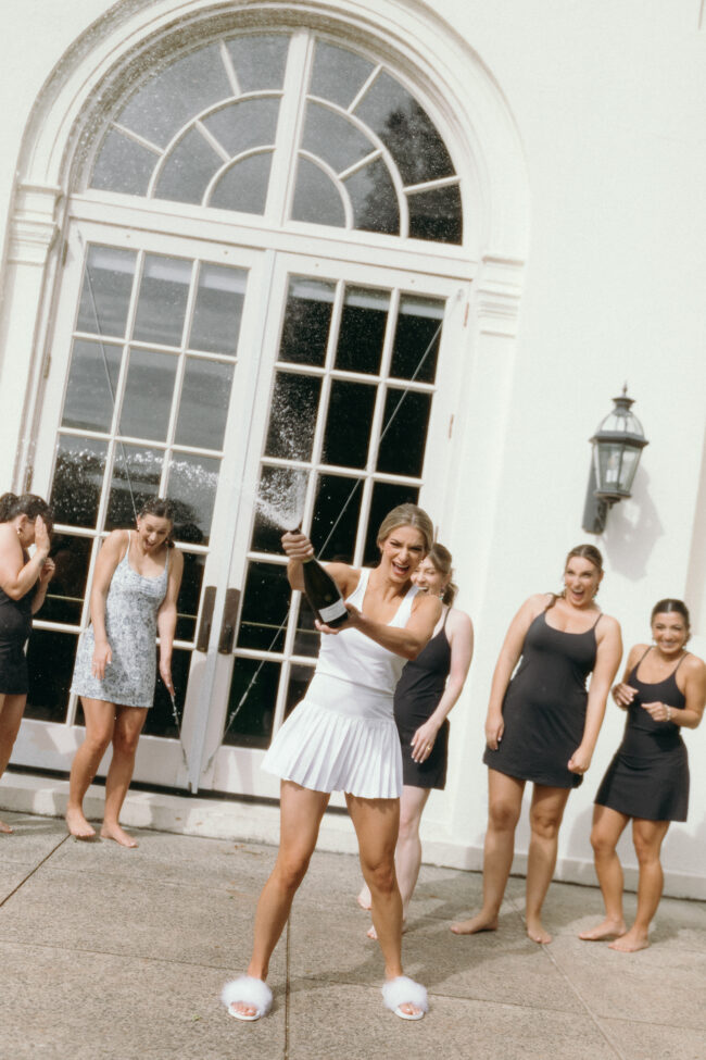 bride and bridal party having fun before getting dressed