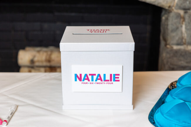 White card box with Pink and Blue logo