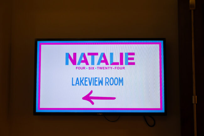 Pink and Blue directional sign