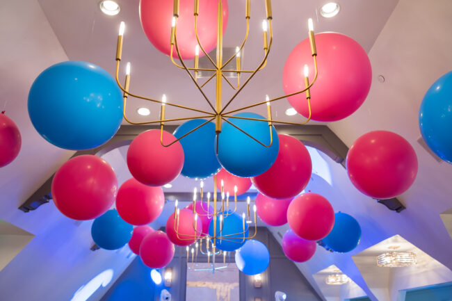Pink and Blue balloons on  the ceiling