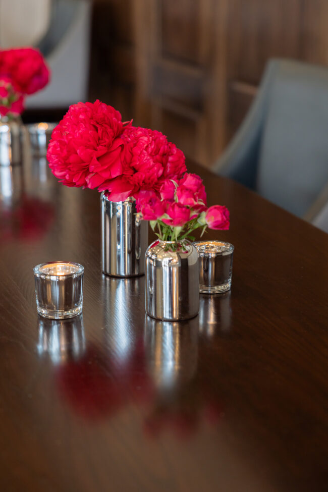 silver votives and pink flowers for adult cocktail tables