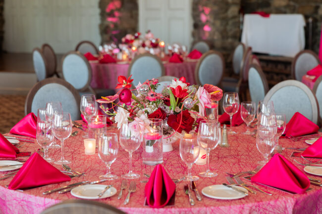 Tablescape with floral centerpieces, votives and acrylic vases