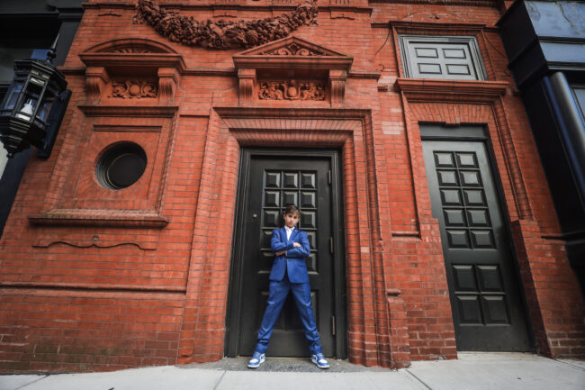 Mitzvah boy standing outside the Goodwin Hotel