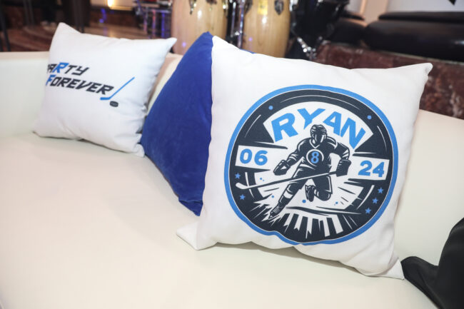 Logo'd pillows on lounge couches