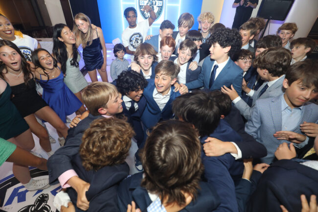 mitzvah boy dancing with friends