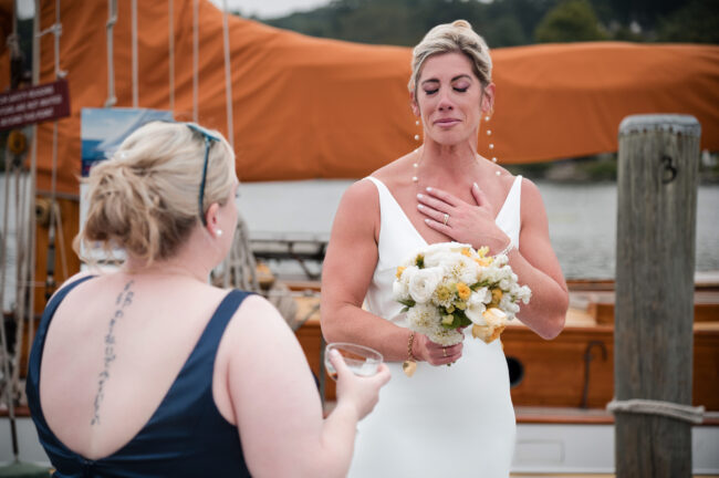 Bride and bridesmaid emotional