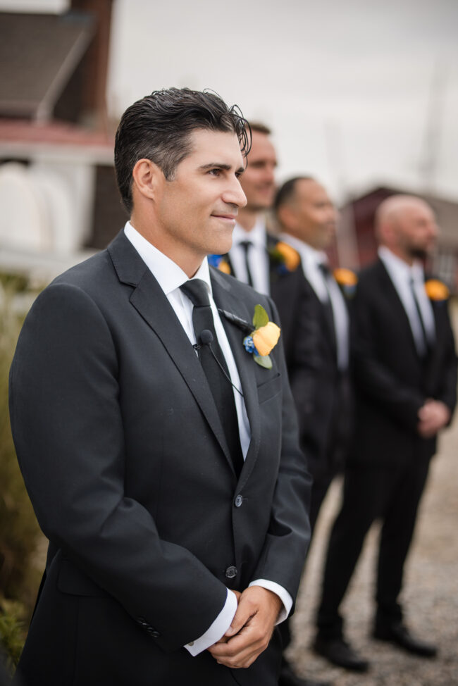 Groom spotting bride walking down aisle