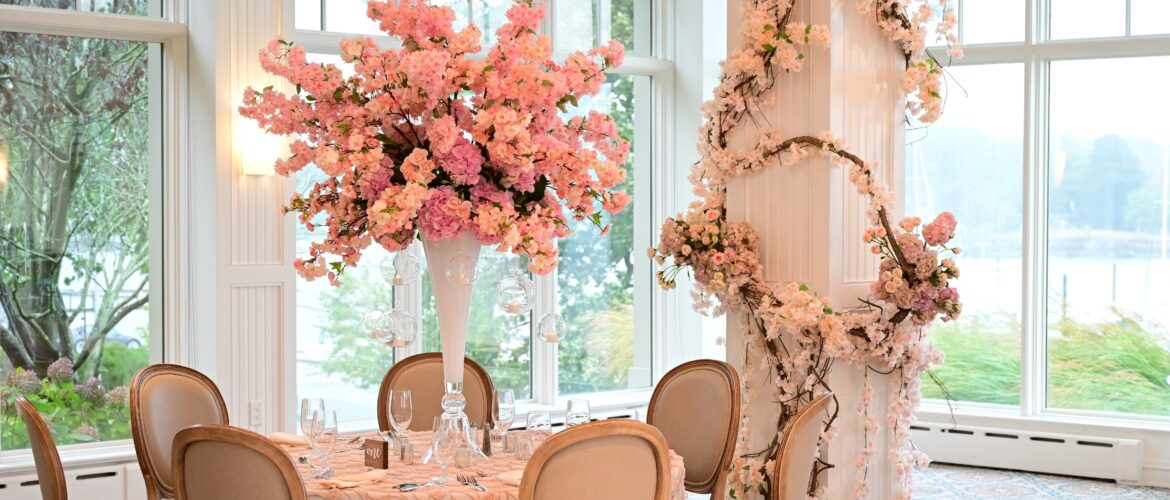 Adult tablescape with floral centerpiece and other floral decor