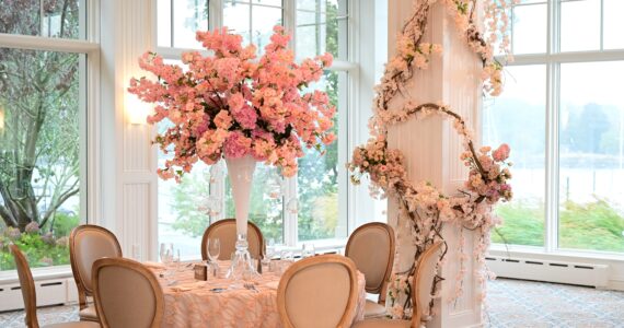 Adult tablescape with floral centerpiece and other floral decor