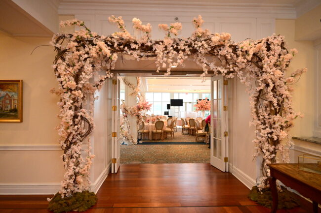 Floral arrangement outlining entrance way to main room