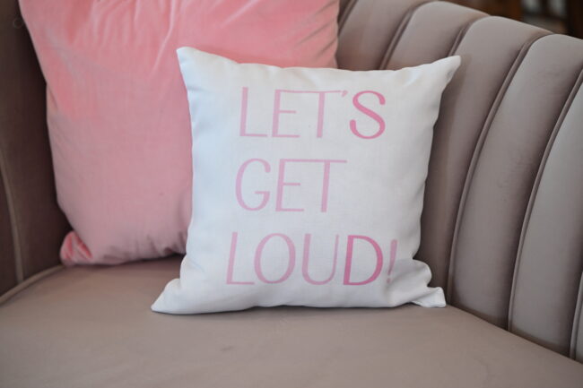 Party tagline on accent pillow in young adult lounge