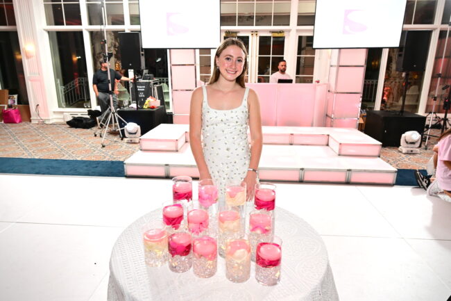 Mitzvah girl presiding over candle-lighting