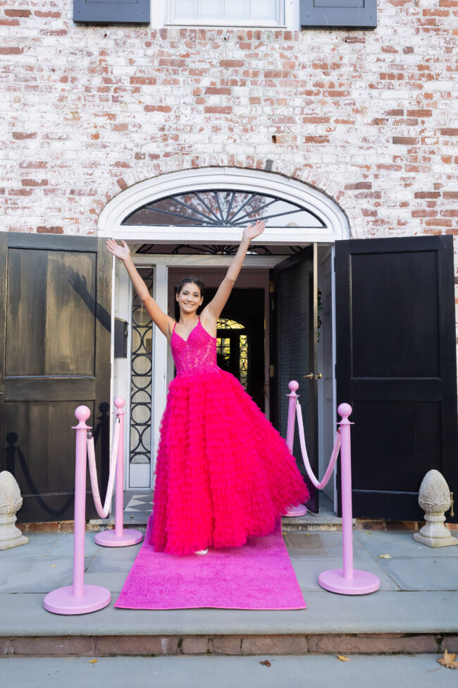 Mitzvah girl posing in front of house