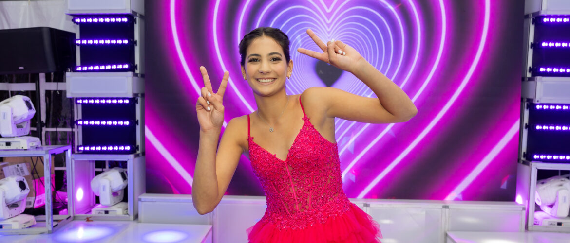 Mitzvah girl posing in front of LED wall