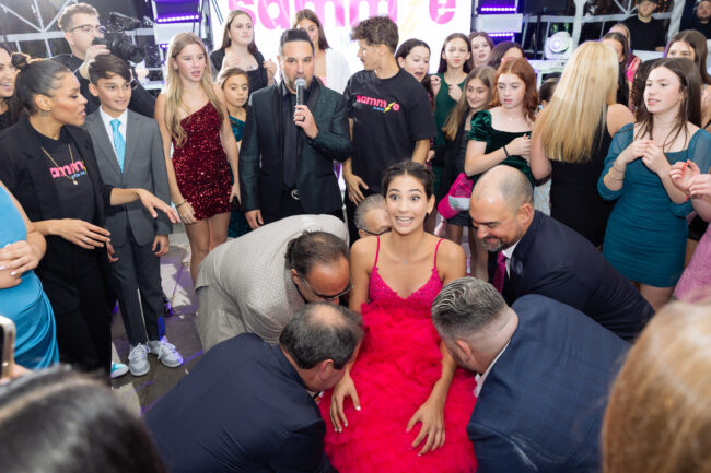 Mitzvah girl lifted in chair during Hora