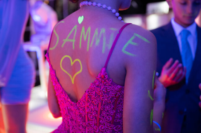 Mitzvah girl with neon blacklight paint