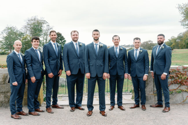 Groom and groomsmen pose for photos pre-ceremony