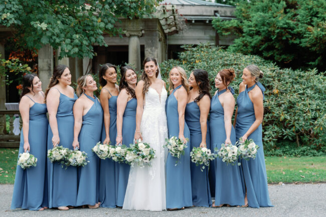 Bride and bridesmaids pose for photos pre-ceremony