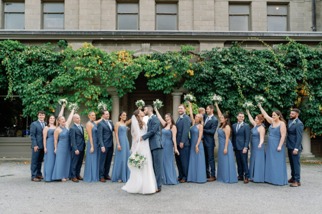 Entire wedding party poses for photos pre-ceremony