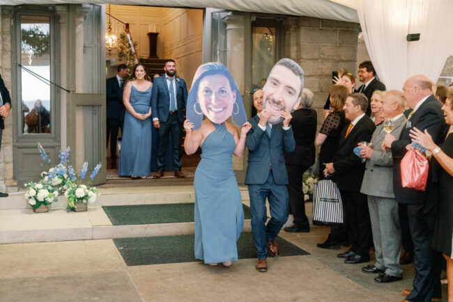 Bridal party intro with giant heads of bride and groom