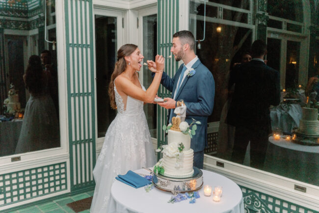 Bride and Groom dishing out wedding cake