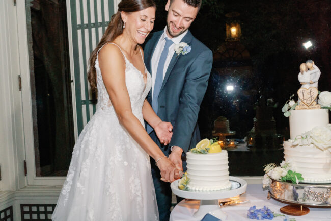 Bride and Groom cutting wedding cake